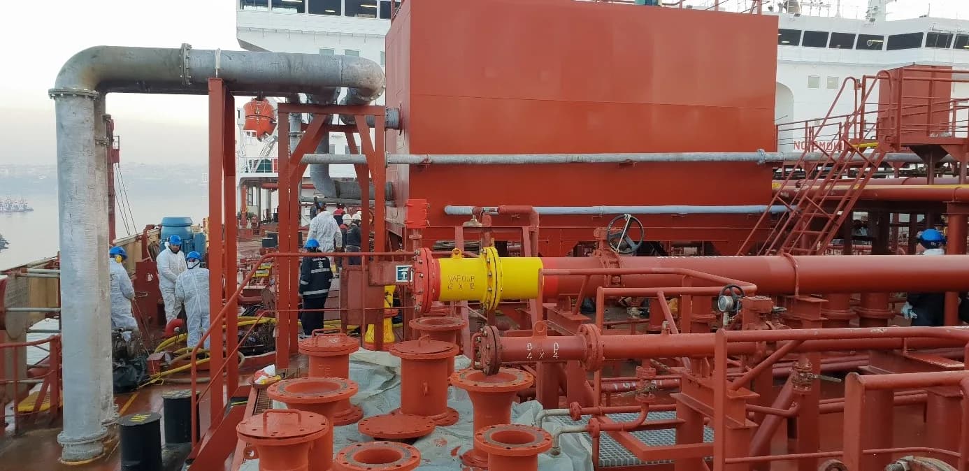 Crew installing a deck pipeline
