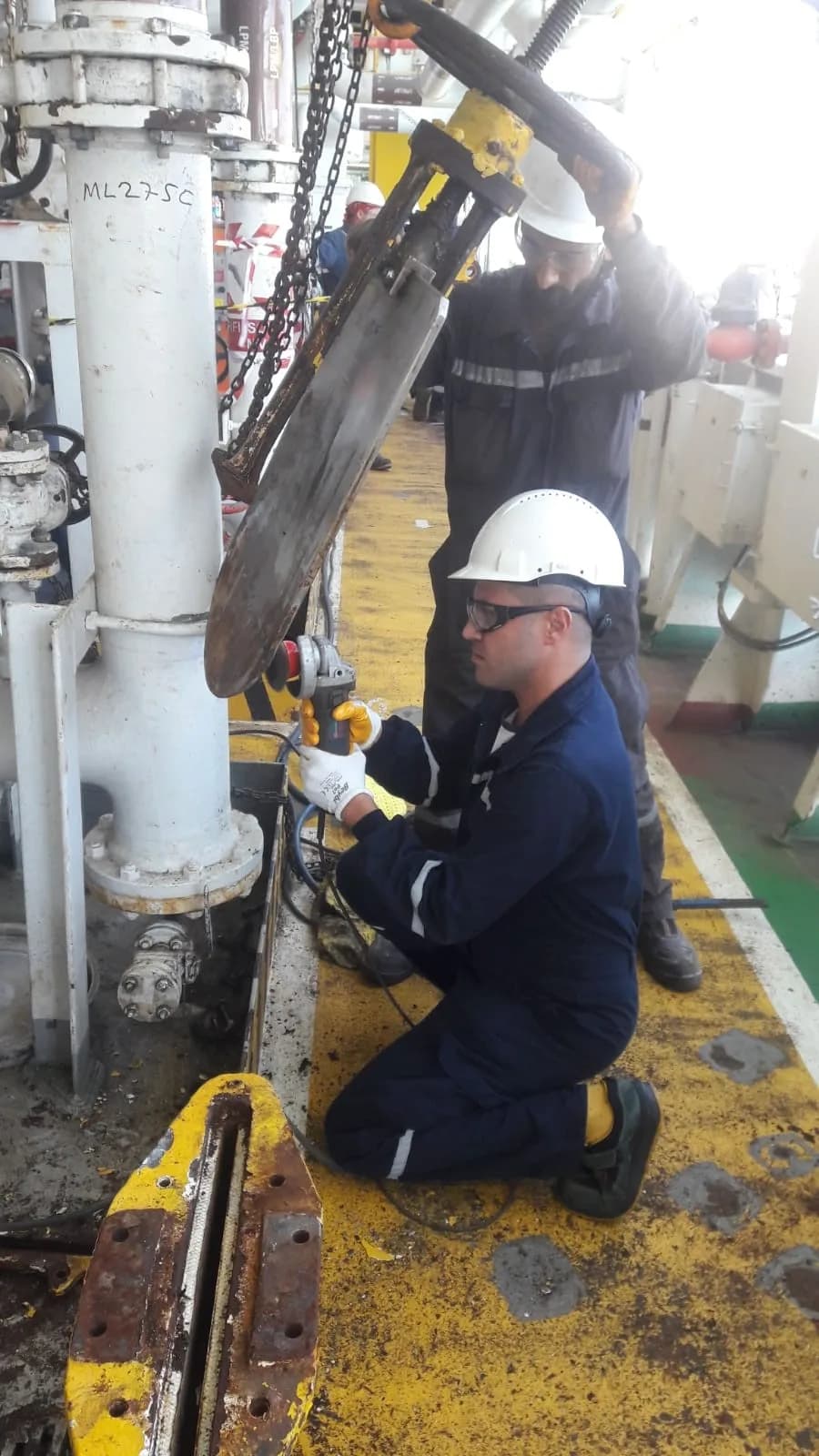 Technician fitting a pipeline